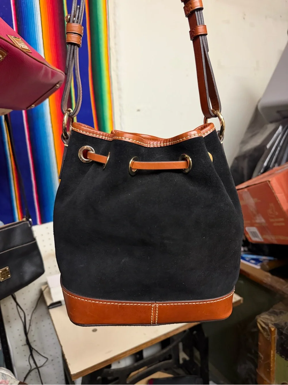 Dooney & Bourke Small Black Suede Bucket Bag with Tan Leather Trim
